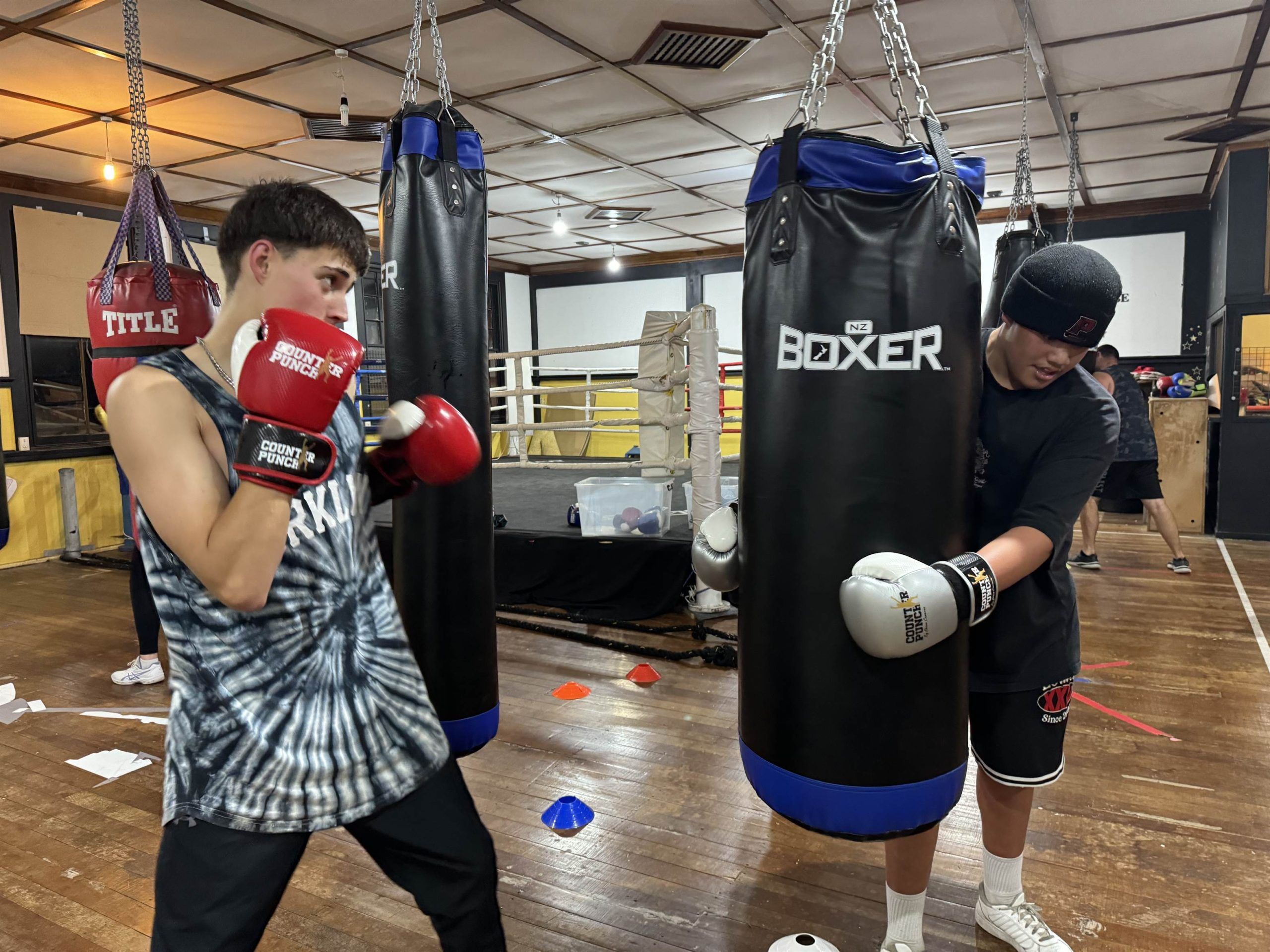 A teenager working the bag.